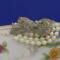 A close up of the pearls and bow button...just the right amount of bling.
